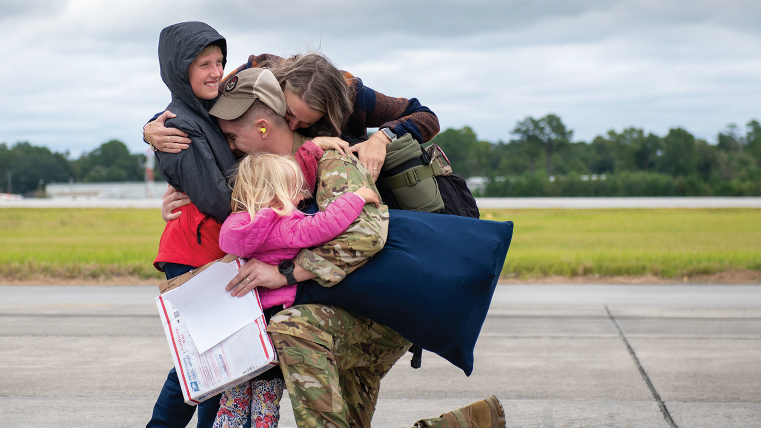 military family hugging