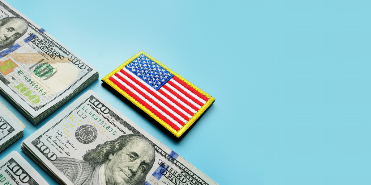 money on blue background with american flag badge