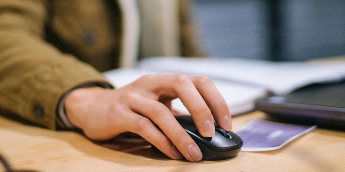 hand on computer mouse