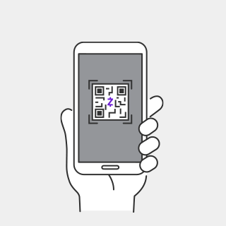 hand holding phone with zelle qr code on screen