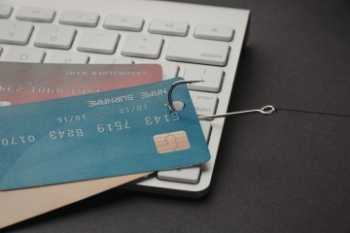 credit cards being pulled by hook Banner