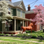 Front porch and horse statue in front of Shelby County Welcome Center 