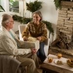 zelle grandparents with gold gift