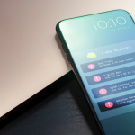 phone with multiple scam text messages on screen