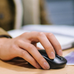 hand on computer mouse