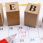 debt scrabble blocks on calendar