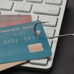 credit cards being pulled by hook